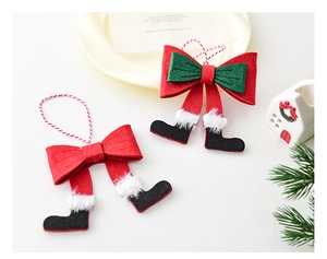 Detail of felt Christmas elf leg bow ornaments with festive green and red color patterns