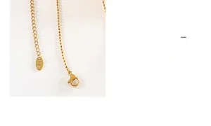 Detail of 18K gold necklace showing the clasp, bead chain and K18 hallmark plaque