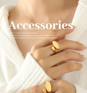 Detail of adjustable 18k gold plated stainless steel ring with minimalist pebble design