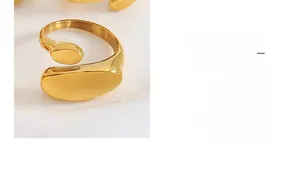 Macro shot of minimalist 18k gold plated stainless steel open ring with dual oval shapes