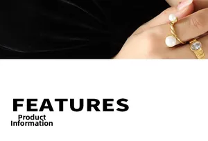 Detail of gold open ring with dual freshwater pearls and twisted metal band texture