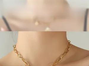 Detail view of a gold paperclip chain necklace styled as a minimalist choker