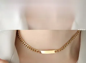 Detail of 18k gold plated stainless steel curb chain with rectangle bar pendant for engraving