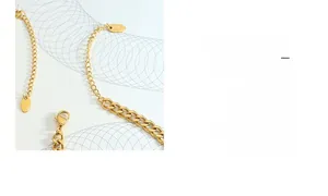 Detail of 18k gold plated lobster clasp and K18 engraved tag on hip hop chain