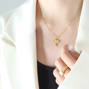 Thai style gold elephant pendant necklace and sparkling gemstone ring set for women