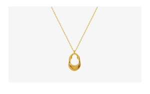 Macro shot of abstract irregular oval pendant with smooth organic lines on 18K gold chain