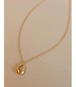 Macro view of 18K gold plated titanium necklace featuring hollow irregular geometric pendant