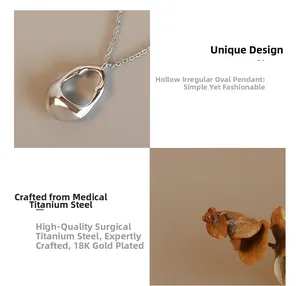 Close-up of a hollow irregular oval pendant made of 18K gold plated titanium steel