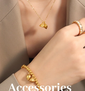 Ethnic style 18K gold plated jewelry set with lotus pod pendants on a model