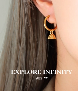 Detailed macro view of 18K gold-plated lotus seed pod hoop earrings for women