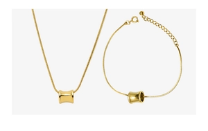 Polished gold waist-drum pendant jewelry set featuring necklace and bracelet