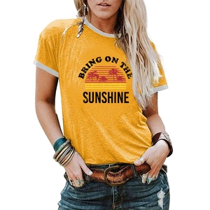 Close-up of Bring On The Sunshine graphic t-shirt with palm tree and retro sunset