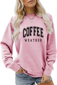 Detail of pink long-sleeve sweatshirt featuring bold COFFEE WEATHER print and ribbed crew neck