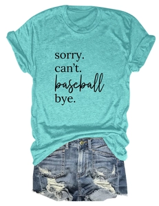 Detail of mint green t-shirt with sorry can't baseball print and distressed denim shorts