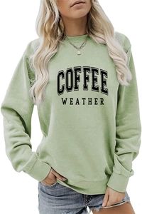Detail of ribbed cuffs and COFFEE WEATHER print on green long sleeve sweatshirt
