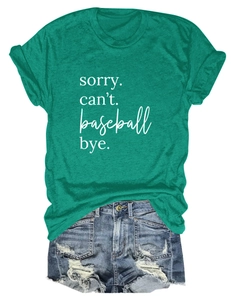 Detail of green round neck t-shirt with Sorry Can't text and blue ripped denim shorts