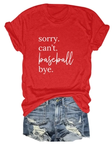 Flat lay of red crew neck t-shirt with white sorry can't baseball print and denim shorts