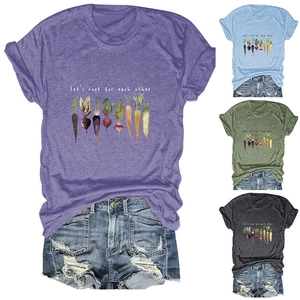 Detail view of cotton blend t-shirts with vegetable graphics and motivational text
