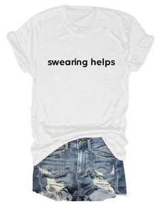 Detail of white cotton T-shirt with black text print paired with distressed denim shorts