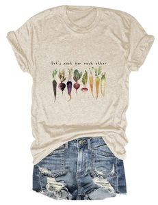Detail of beige cotton t-shirt with vegetable print and distressed denim shorts