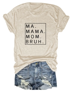 Flat lay of beige cotton T-shirt with Mama Mom Bruh print and ripped denim shorts