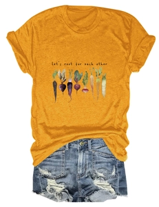 Detail of Let's root for each other slogan and vegetable graphics on ginger t-shirt