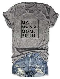 Flat lay of gray T-shirt with MAMA MOM BRUH print and distressed denim shorts set