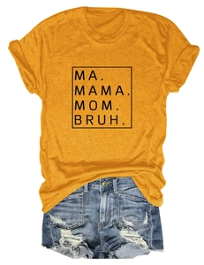 Flat lay of a mustard yellow cotton T-shirt with Mama Mom Bruh print and denim shorts