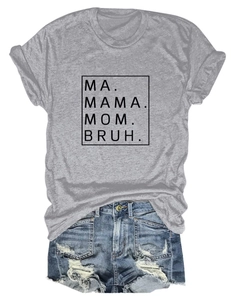 Close-up of MA MAMA MOM BRUH print on casual grey t-shirt with ripped denim shorts