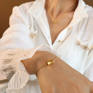 Polished 18K gold-plated stainless steel cylinder necklace and bracelet set for women