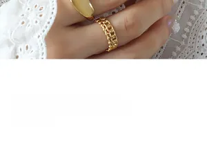 Close-up of gold double ring set featuring a smooth polished band and chain design