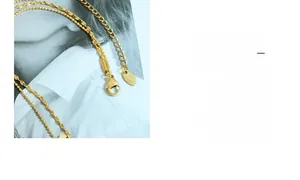 Detail of gold double-layered choker with geometric sequins and KIS tag engraving