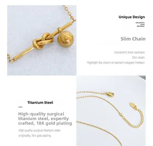 Macro detail of knot pendant and gold bead showing 18K gold plated titanium steel finish