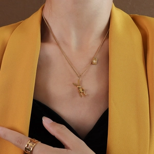 Gold plated rabbit pendant and square tag necklace with geometric wide band ring set