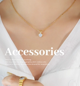 Close-up of 18K gold-plated titanium steel necklace and ring with claw-set zircon