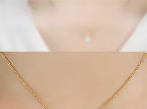 Macro shot of 18K gold plated titanium chain necklace with sparkling zircon pendant detail