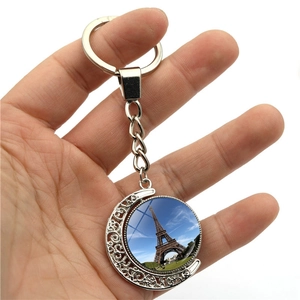 Eiffel Tower rotating keychain with crescent moon pendant and double-sided glass dome charm