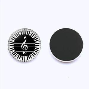 Detail of music themed fridge magnets with piano keys and musical notes design