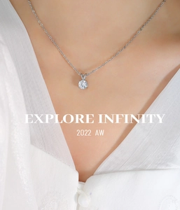 Macro shot of silver titanium steel necklace featuring a brilliant round four-prong zircon