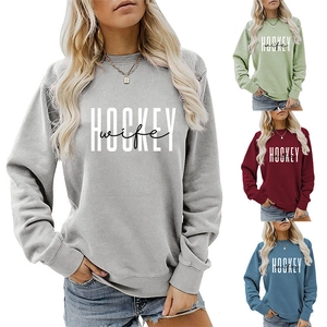 Detail view of the ribbed crewneck and Hockey Wife print on comfortable women's sweatshirts