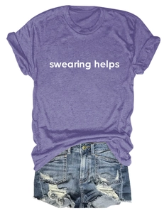 Detail view of purple 'swearing helps' t-shirt paired with distressed denim shorts