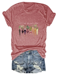 Flat lay of a red cotton T-shirt with vegetable graphics and distressed denim shorts