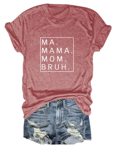 Detail view of brick red T-shirt with Mama Mom Bruh text and blue distressed denim shorts