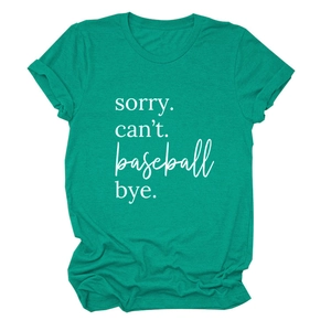 Close-up of SORRY CAN'T printed letters on green crew neck cotton t-shirt fabric