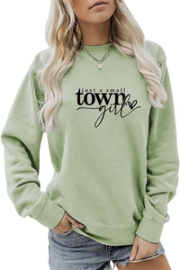 Close-up of just a small town girl graphic and ribbed collar on sage green sweatshirt