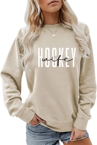 Detail of HOCKEY wife print on apricot crewneck sweatshirt with ribbed cuffs and collar