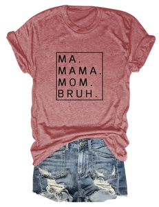 Detail view of brick red t-shirt with black MA MAMA MOM BRUH text and denim shorts