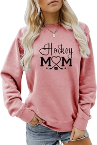 Detailed view of the Hockey Mom print with heart and sticks on a pink crewneck sweater