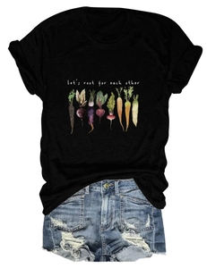 Flat lay of black cotton t-shirt with vegetable illustration and casual denim shorts