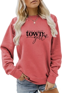 Detail of just a small town girl heart print on coral pink crewneck sweatshirt
